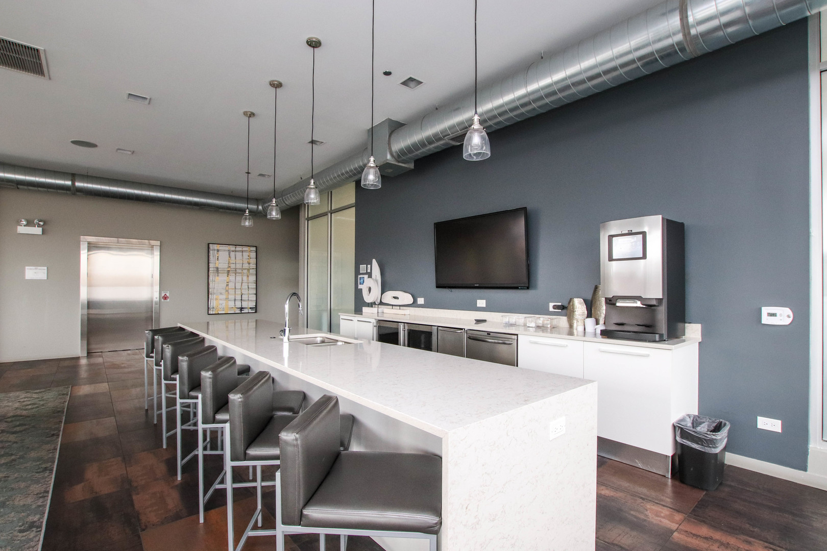 1313 West Randolph Street, Unit 203 Chicago, IL 60607 - Photo 10 of 18 a living room with furniture and a flat screen tv