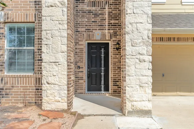 a front view of a building with a garden
