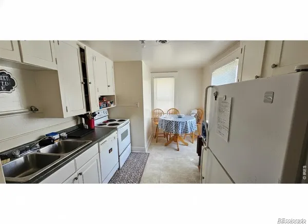 a kitchen with stainless steel appliances a refrigerator and a stove