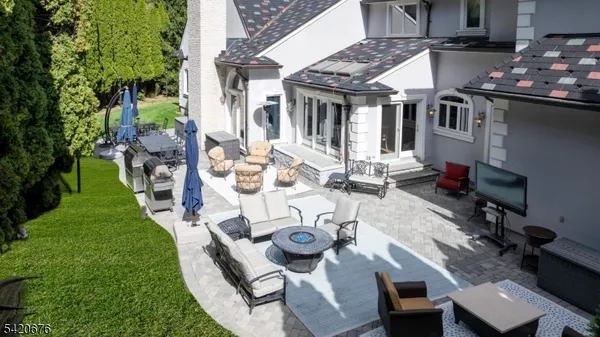 a view of yard with patio