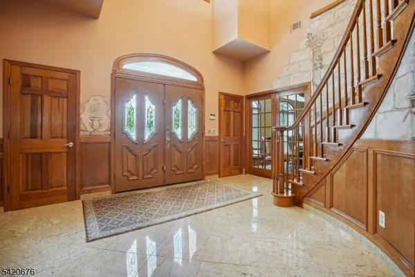 a view of an entryway with staircase