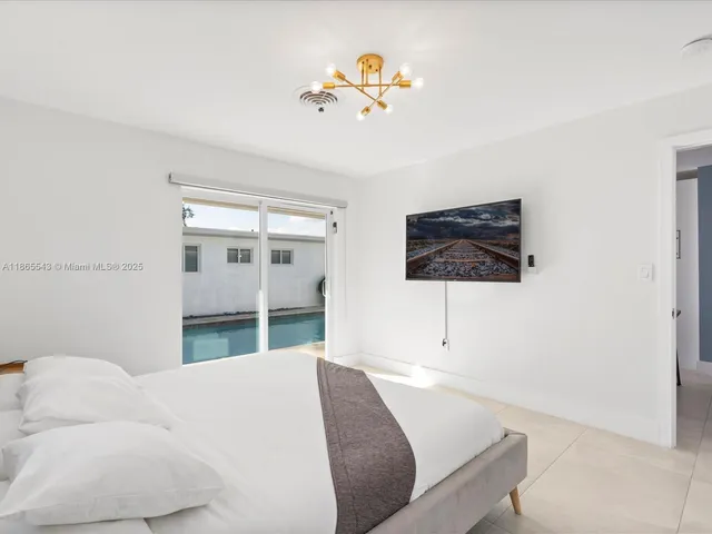 a bedroom with a bed and a table