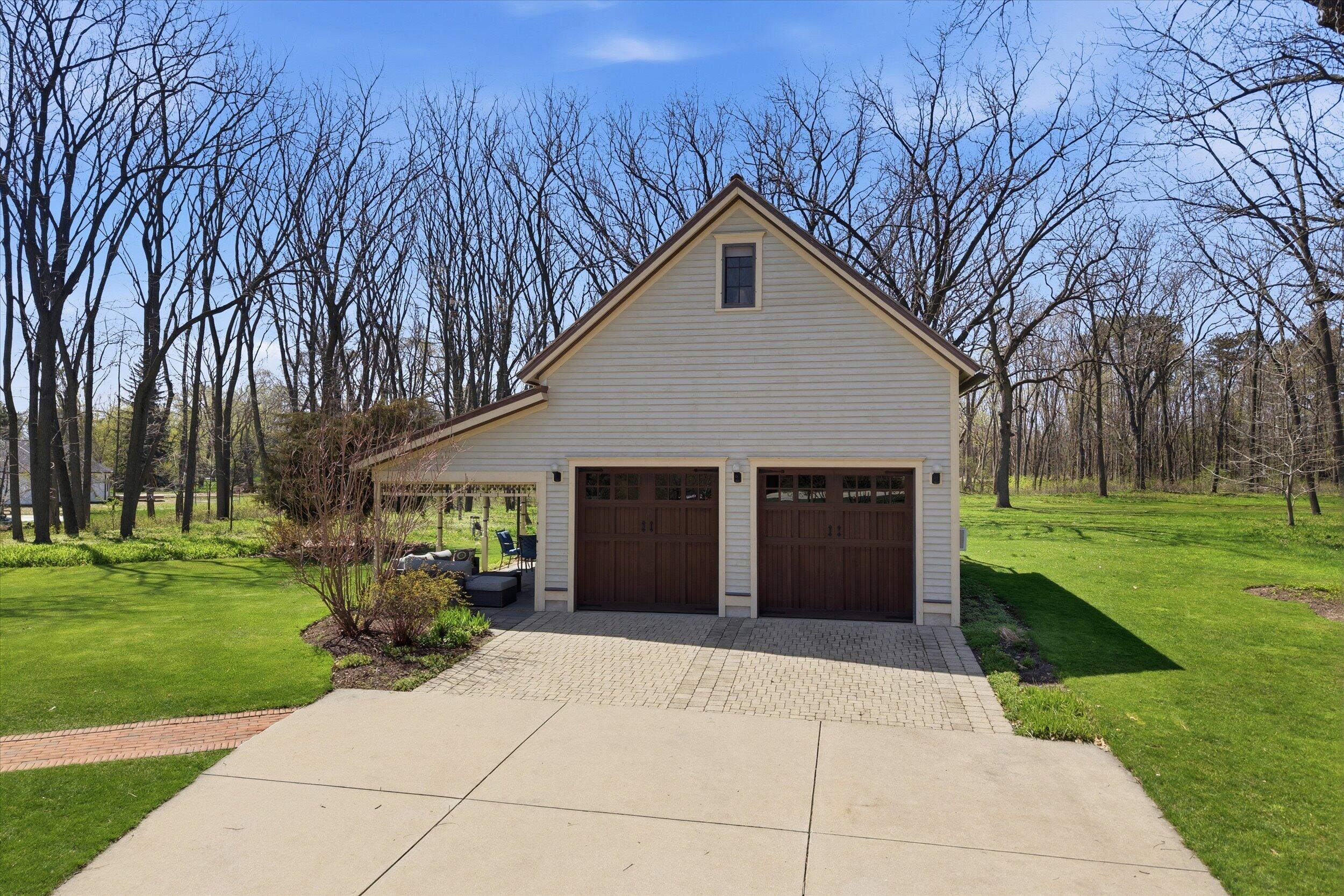 S84W17698 Woods Road Muskego, WI 53150 - Photo 29 of 50 Heated Garage With Partial Kitchen inside + Bonus Room