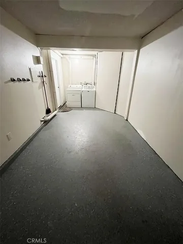 a view of a bathroom with a granite countertop sink and a mirror
