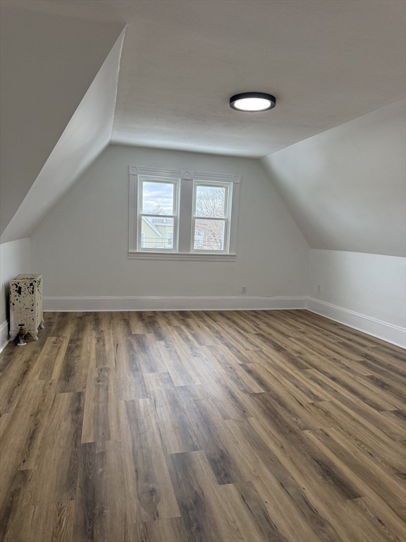 120 Graham Street, Unit 3 Gardner, MA 01440 - Photo 12 of 13 an empty room with wooden floor and windows