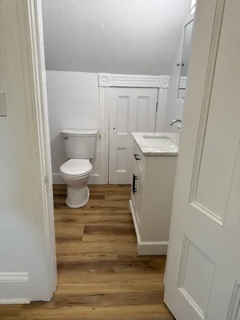 a view of room with window and hardwood floor