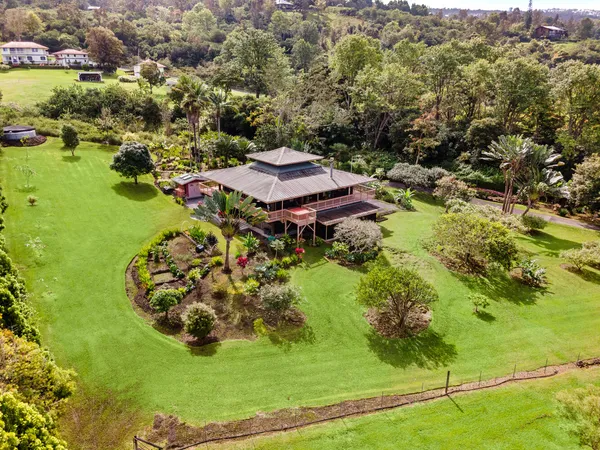 an aerial view of a house with a garden