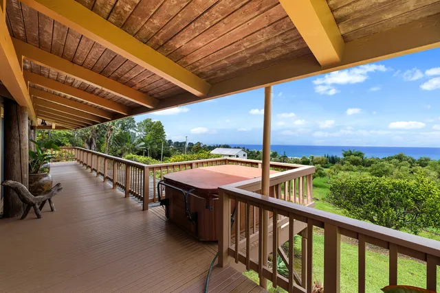 a view of a balcony with chairs