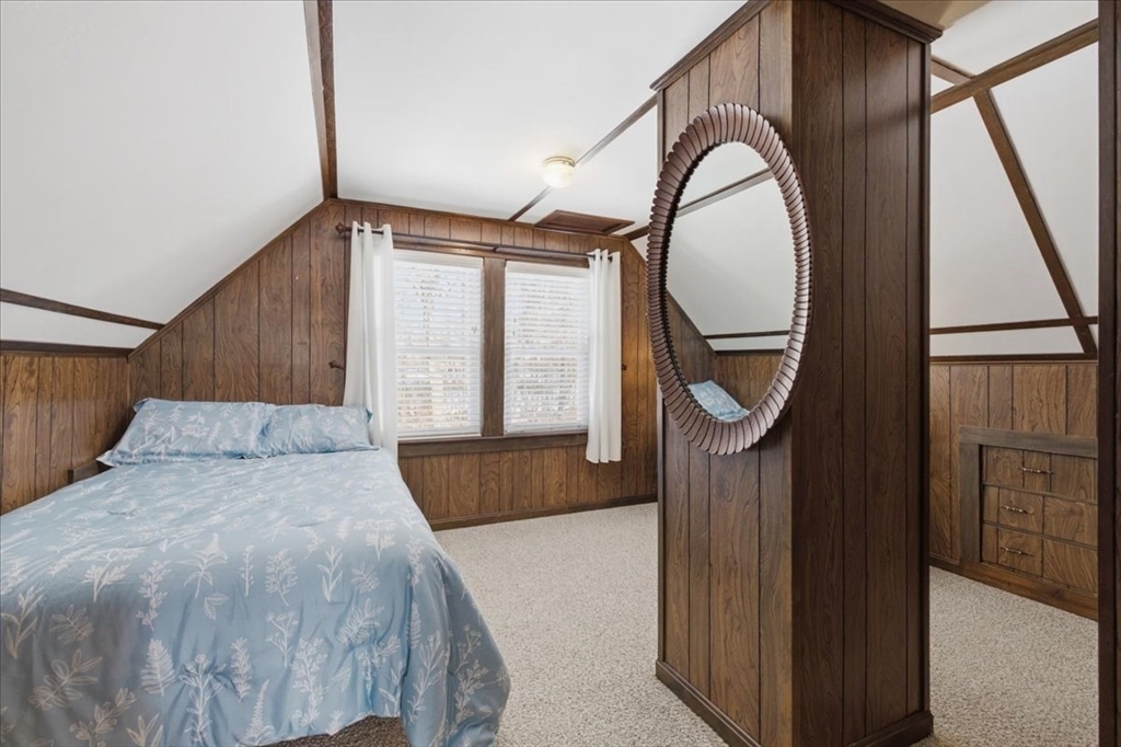 72 Crane Street Dedham, MA 02026 - Photo 26 of 42 a bedroom with a bed a mirror and a window