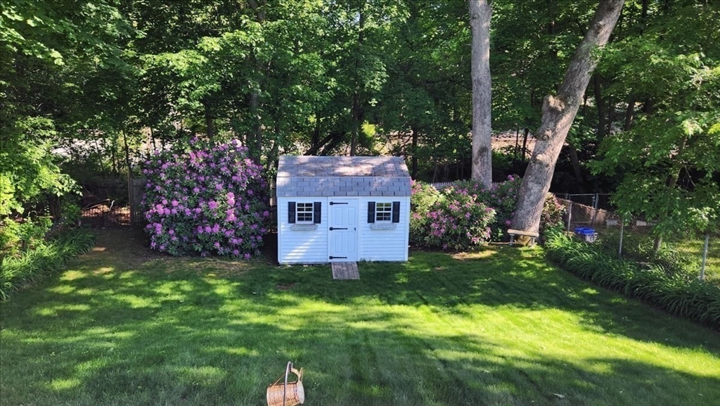 72 Crane Street Dedham, MA 02026 - Photo 36 of 42 a view of a house with a big yard and large trees
