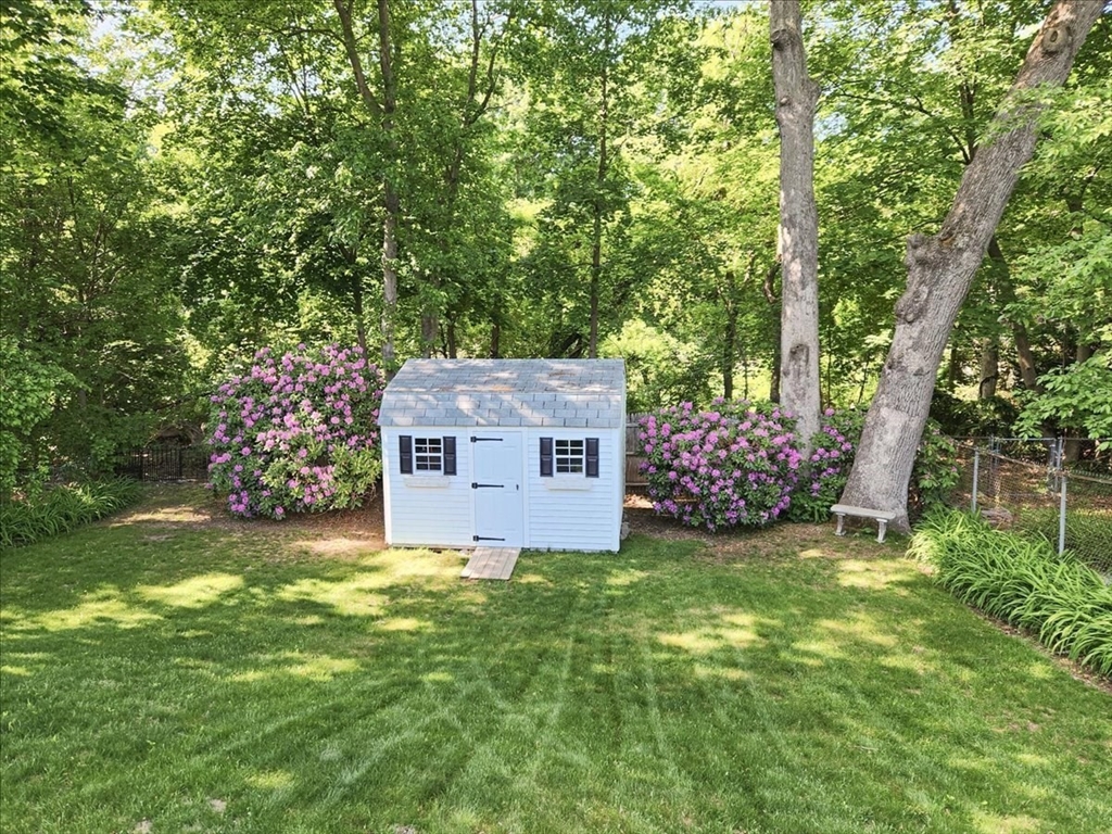 72 Crane Street Dedham, MA 02026 - Photo 38 of 42 a view of a house with a yard