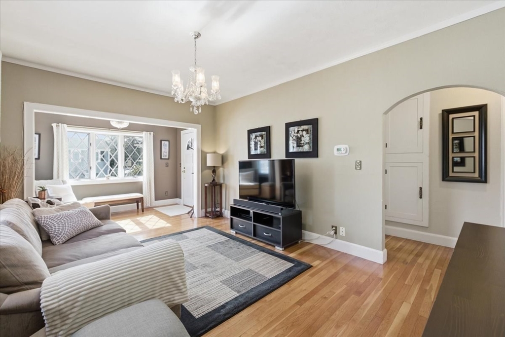 72 Crane Street Dedham, MA 02026 - Photo 6 of 42 a living room with furniture and a flat screen tv