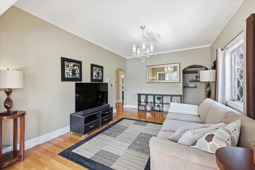 72 Crane Street Dedham, MA 02026 - Photo 8 of 42 a living room with furniture and a flat screen tv
