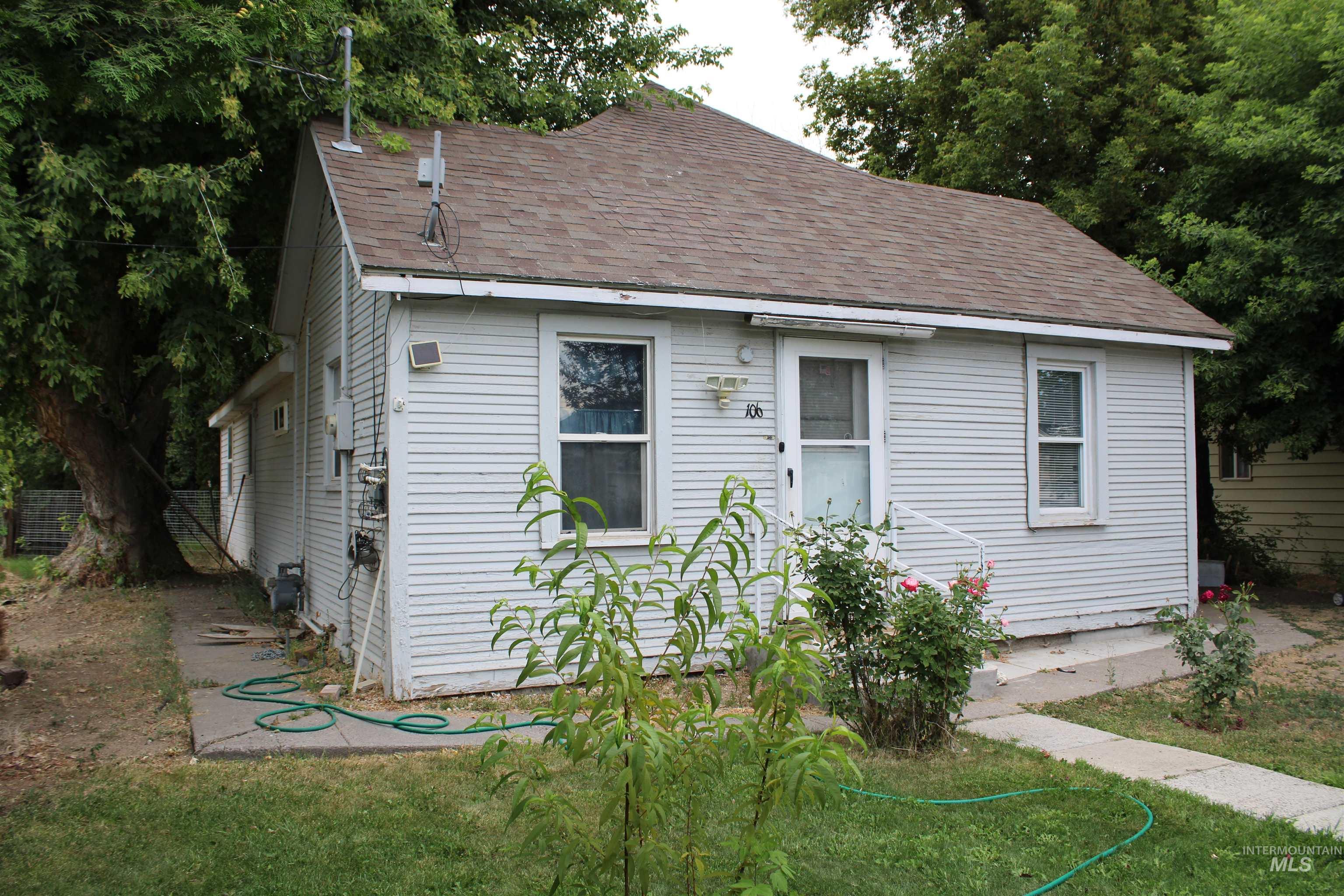 View of front of home featuring roof with shingles