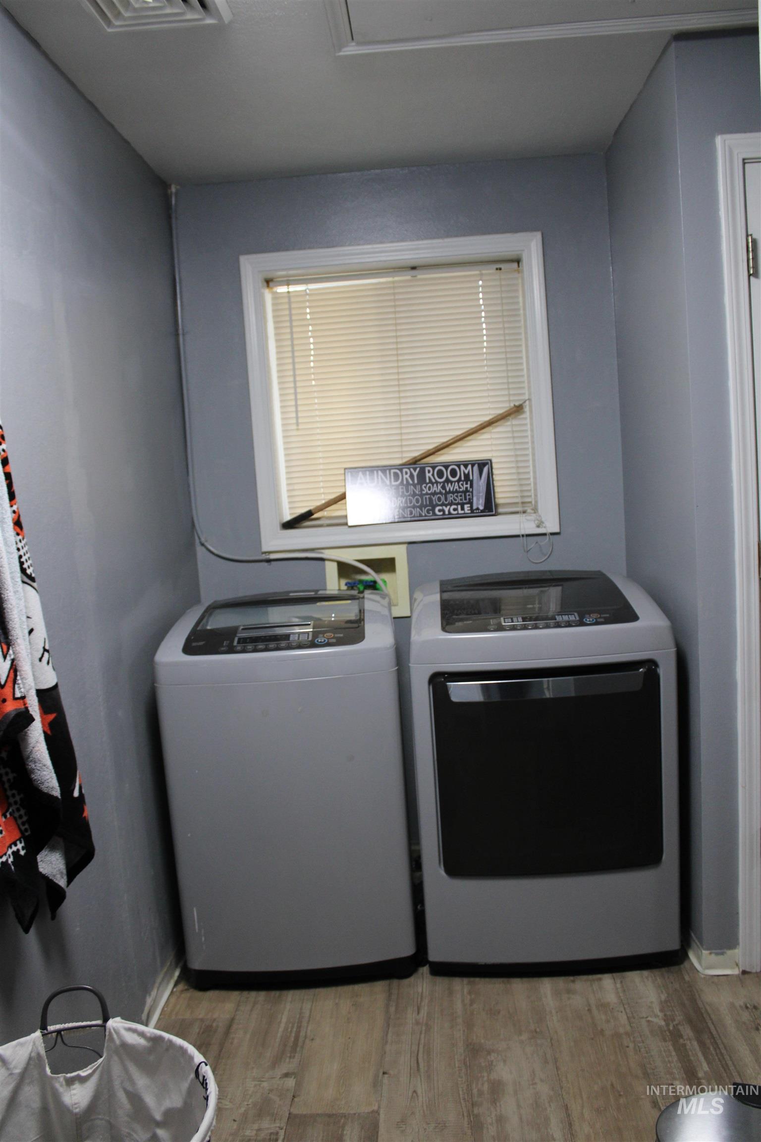 106 3rd Street West Declo, ID 83323 - Photo 19 of 23 Laundry area featuring washer and dryer and light wood-type flooring