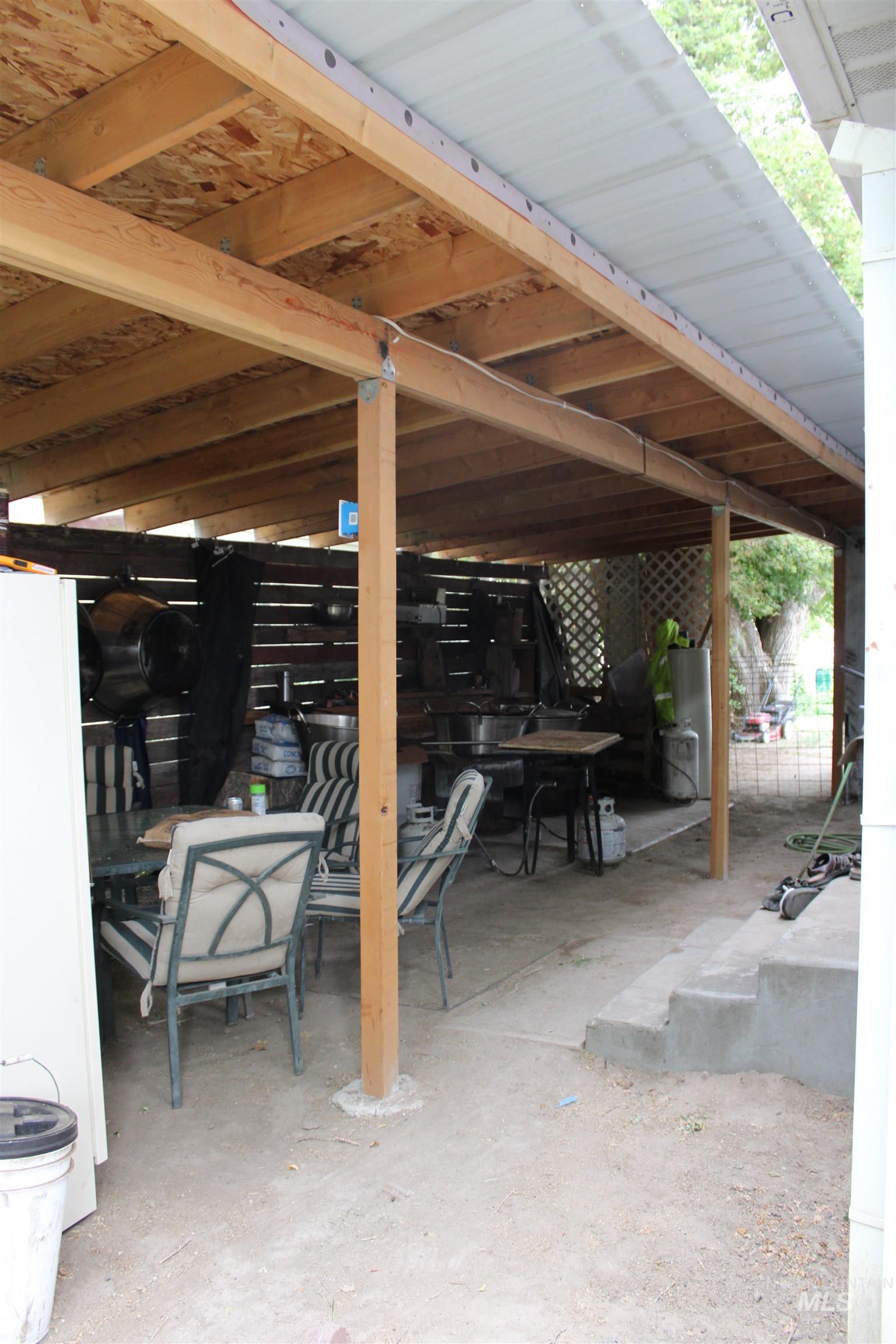 106 3rd Street West Declo, ID 83323 - Photo 23 of 23 View of patio / terrace with outdoor dining area and water heater