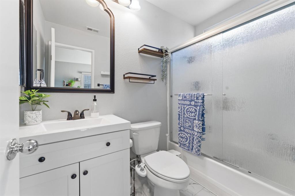 2373 Kings View Circle Spring Valley, CA 91977 - Photo 14 of 28 a bathroom with a sink a toilet and shower
