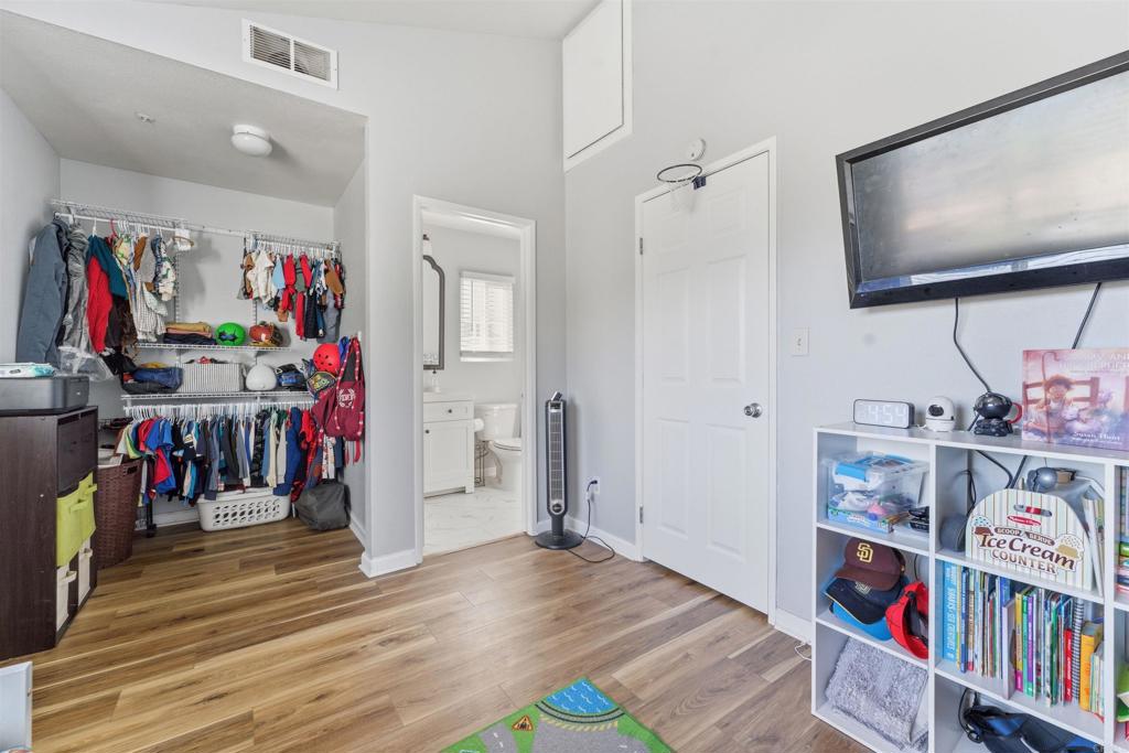 2373 Kings View Circle Spring Valley, CA 91977 - Photo 17 of 28 a view of walk in closet with clothes and shoes