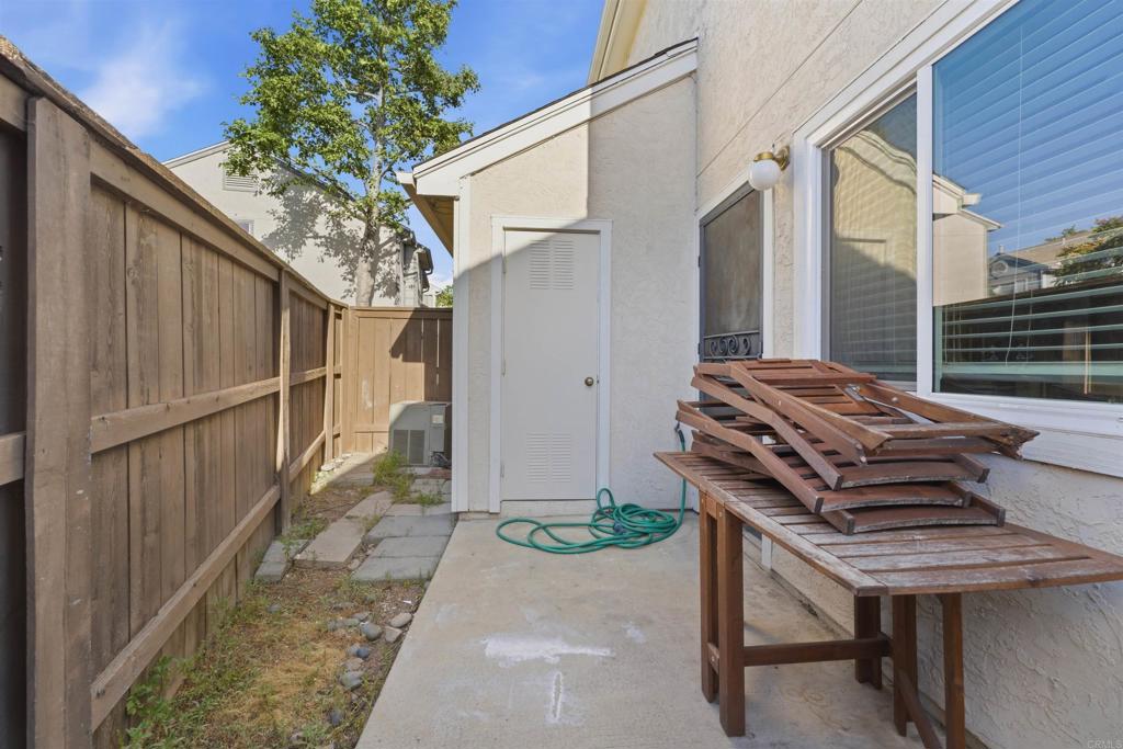 2373 Kings View Circle Spring Valley, CA 91977 - Photo 20 of 28 a backyard of a house with wooden floor outdoor seating and oven