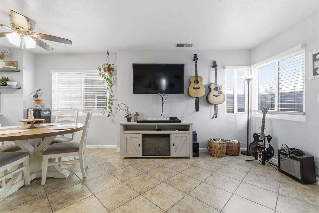 2373 Kings View Circle Spring Valley, CA 91977 - Photo 7 of 28 a living room with furniture and a flat screen tv