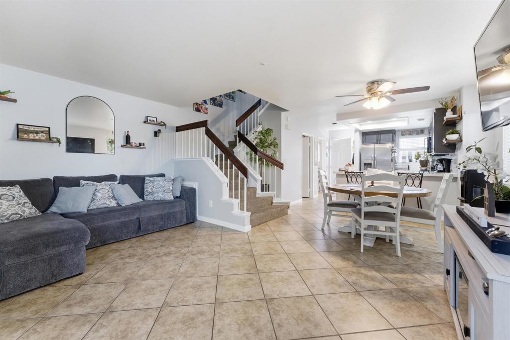 2373 Kings View Circle Spring Valley, CA 91977 - Photo 9 of 28 a living room with furniture and a kitchen