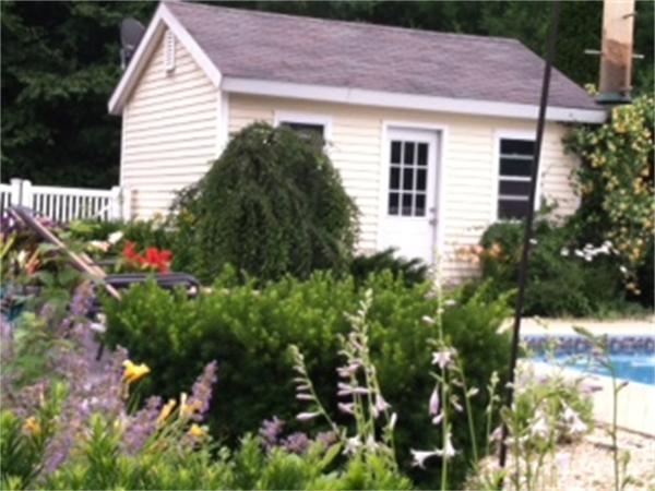 6 Houghton's Mill Road Lunenburg, MA 01462 - Photo 25 of 28 a backyard of a house with a lot of flower plants