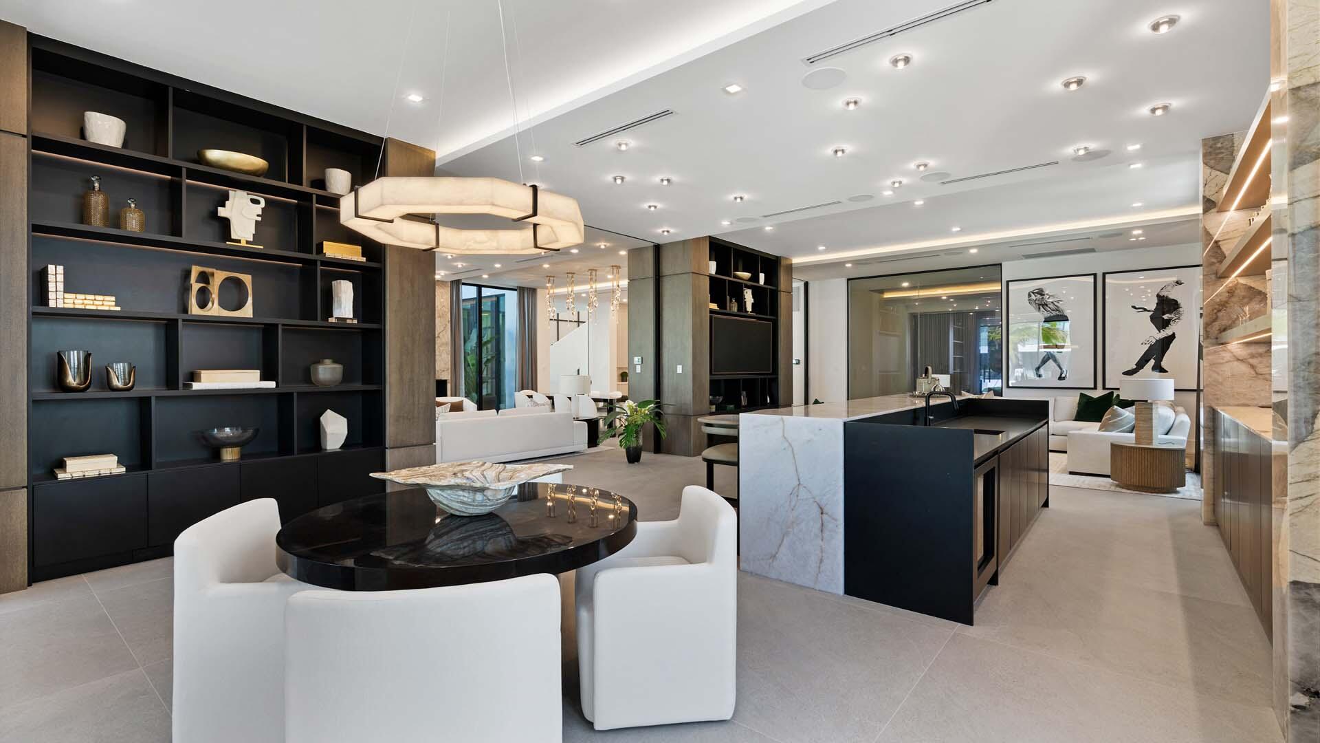 207 Coconut Palm Road Boca Raton, FL 33432 - Photo 18 of 62 a living room with furniture and a book shelf