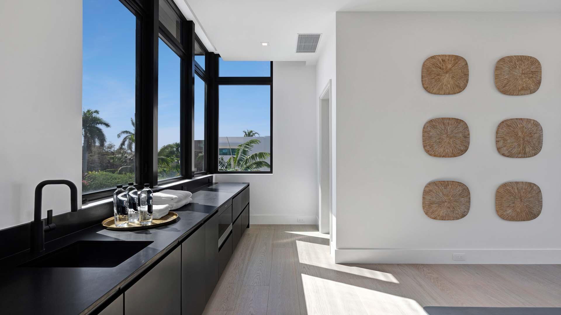 207 Coconut Palm Road Boca Raton, FL 33432 - Photo 35 of 62 a kitchen with a sink and a stove