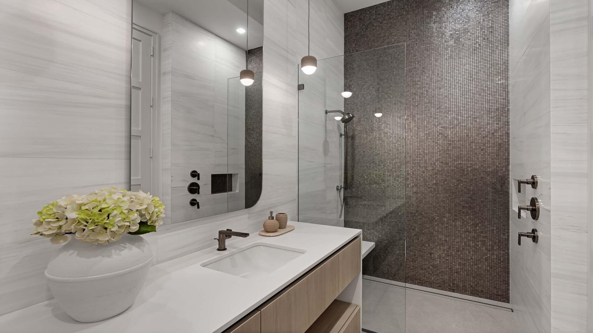 207 Coconut Palm Road Boca Raton, FL 33432 - Photo 41 of 62 a bathroom with a sink toilet a mirror and shower