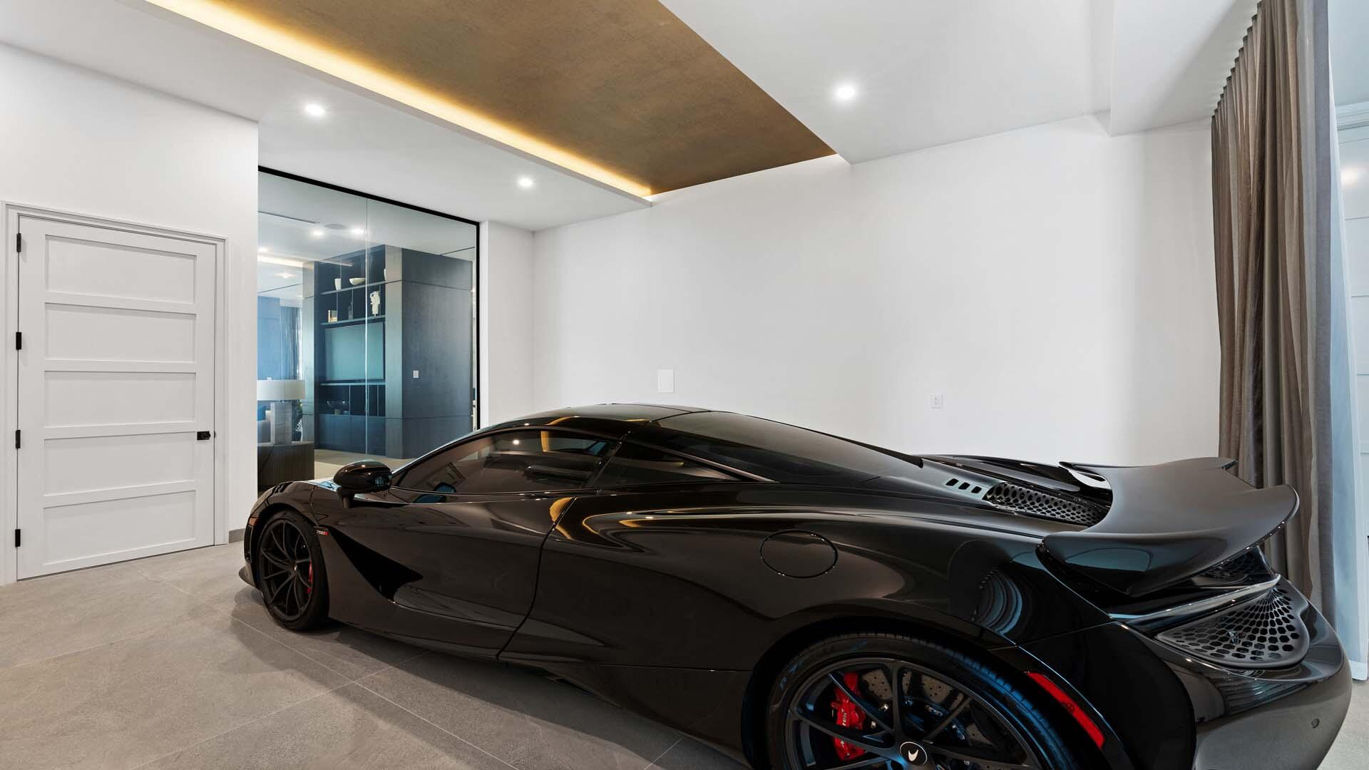 207 Coconut Palm Road Boca Raton, FL 33432 - Photo 56 of 62 a car parked in a garage