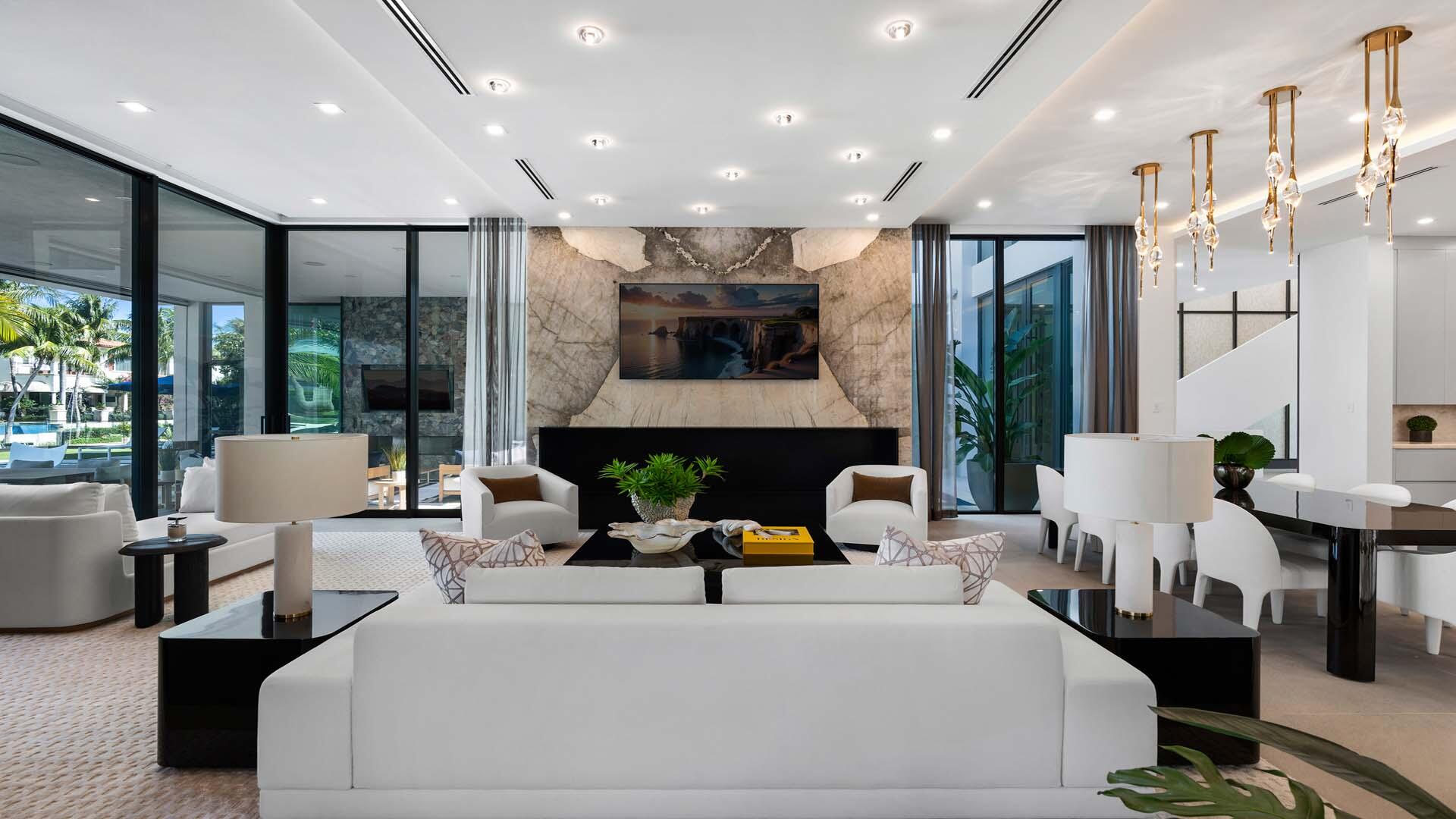 207 Coconut Palm Road Boca Raton, FL 33432 - Photo 10 of 62 a living room with furniture a fireplace and a chandelier