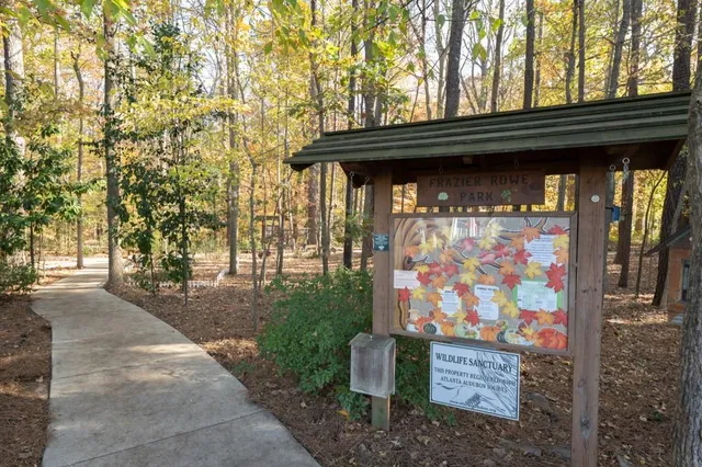 a view of a house with garden and sitting area