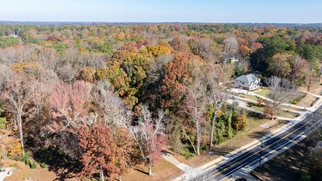 an aerial view of house with yard