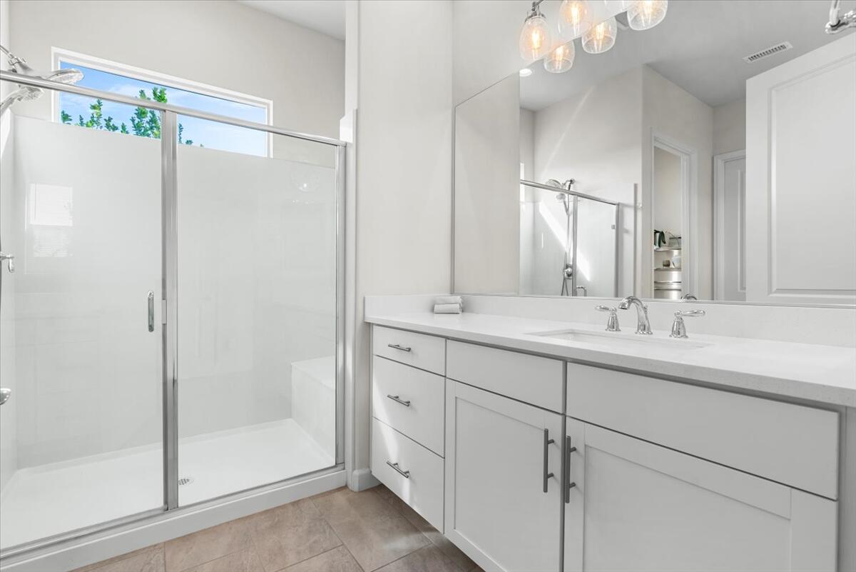 19 Syrah Rancho Mirage, CA 92270 - Photo 30 of 71 a bathroom with a double vanity sink mirror and shower