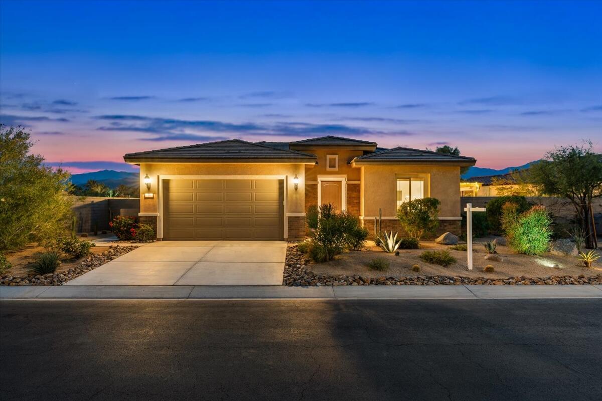 19 Syrah Rancho Mirage, CA 92270 - Photo 59 of 71 a front view of a house with a garden