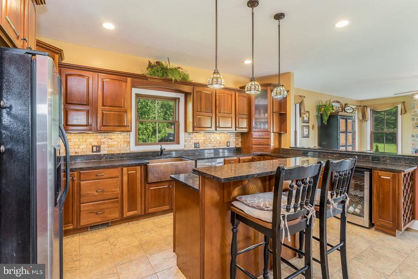 132 Ridge Road Timberville, VA 22853 - Photo 18 of 71 a kitchen with a table chairs sink and wooden floor