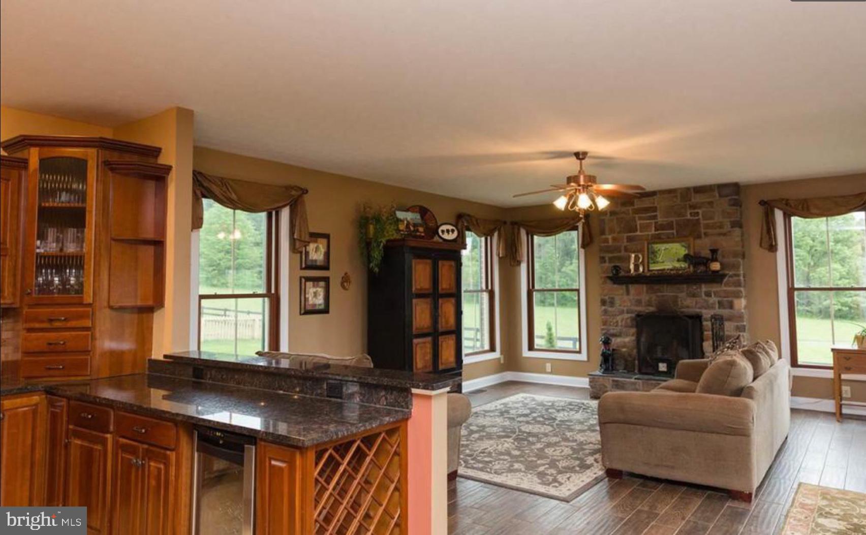132 Ridge Road Timberville, VA 22853 - Photo 19 of 71 a living room with furniture a fireplace and a flat screen tv