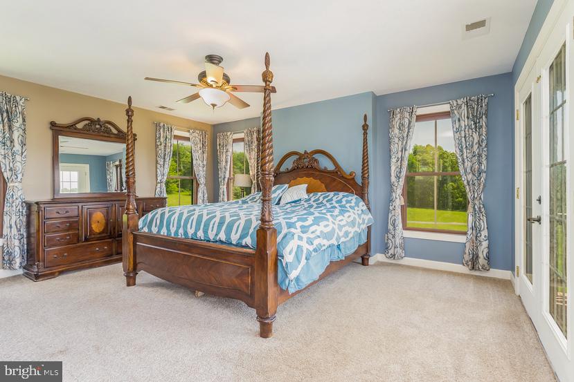 132 Ridge Road Timberville, VA 22853 - Photo 28 of 71 a bed sitting in a spacious bedroom next to a window