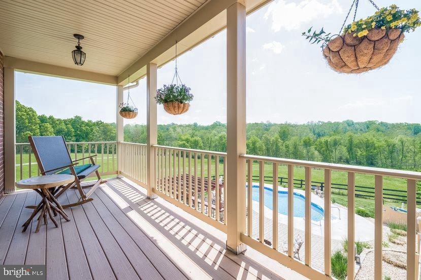 132 Ridge Road Timberville, VA 22853 - Photo 30 of 71 a view of a balcony with chair and wooden floor