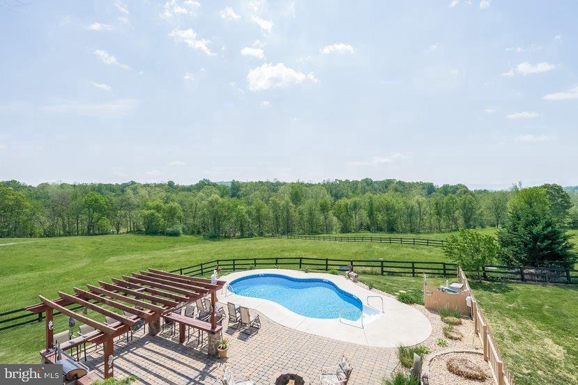 132 Ridge Road Timberville, VA 22853 - Photo 31 of 71 a view of a backyard with a garden and entertaining space