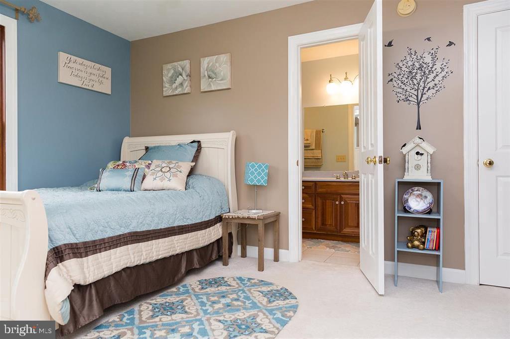 132 Ridge Road Timberville, VA 22853 - Photo 35 of 71 a bedroom with a bed and a cabinets