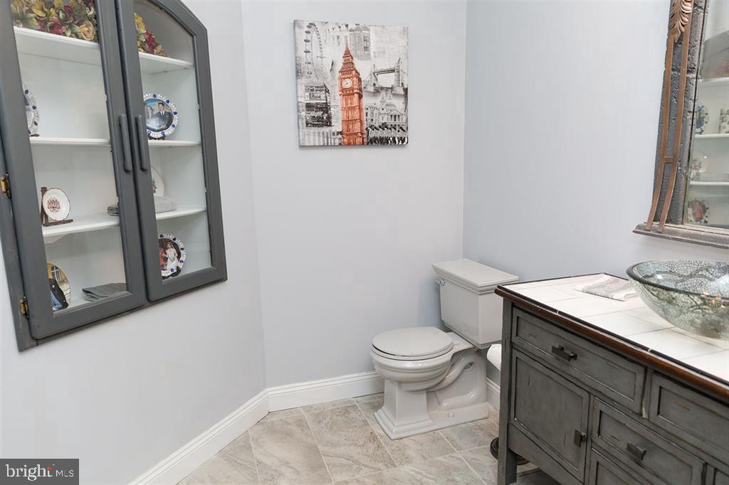132 Ridge Road Timberville, VA 22853 - Photo 44 of 71 a bathroom with a granite countertop toilet and a sink