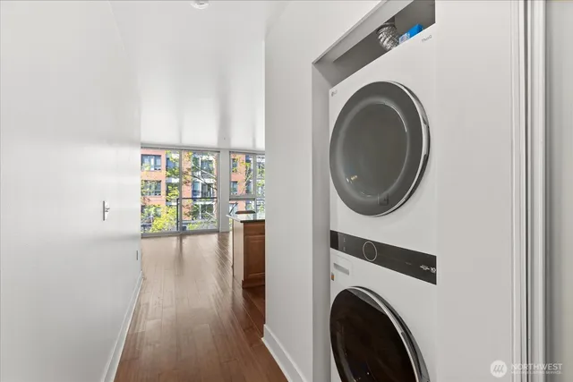 a view of a hallway with washer and dryer