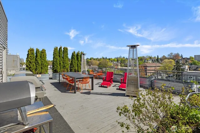 a view of a swimming pool with lawn chairs