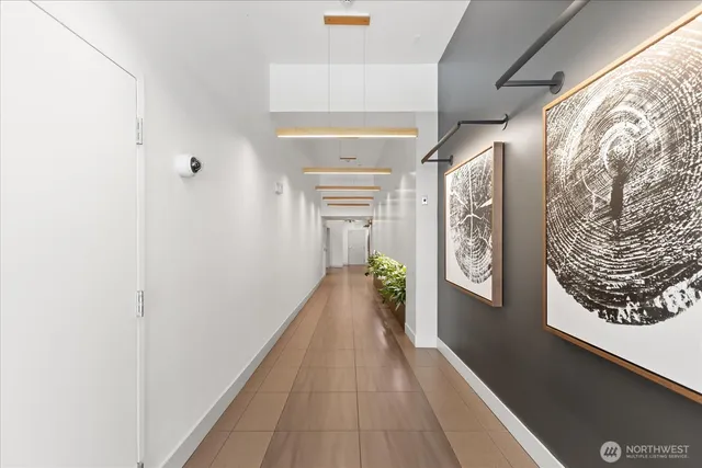 a view of backyard with table and chairs and potted plants