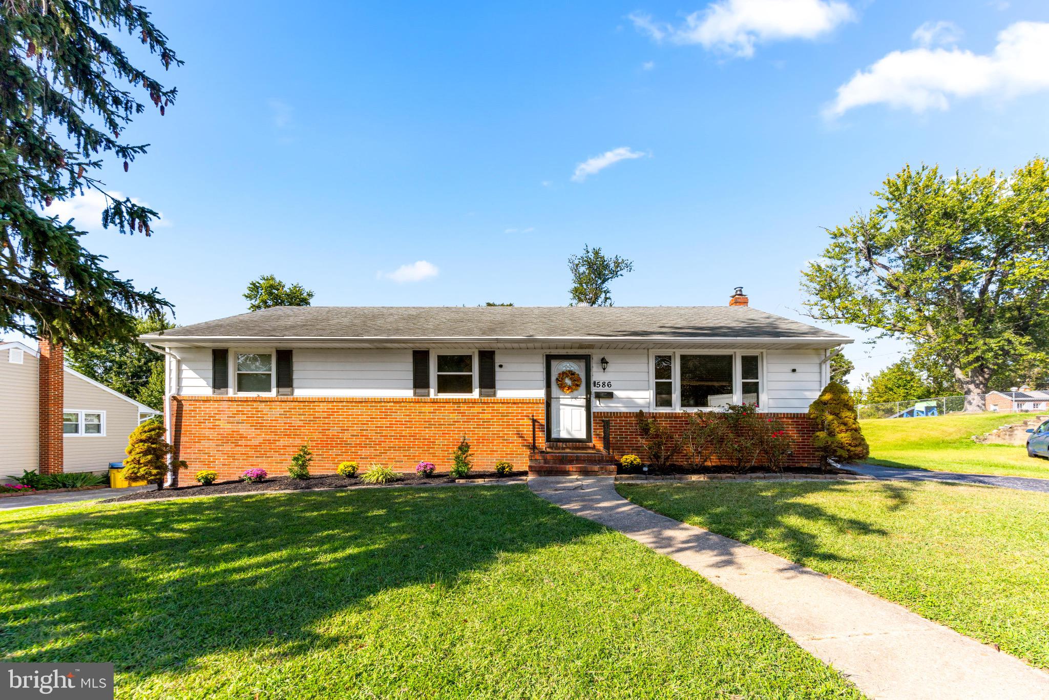 586 Forest View Road Linthicum Heights, MD 21090 - Photo 1 of 28 a front view of a house with garden