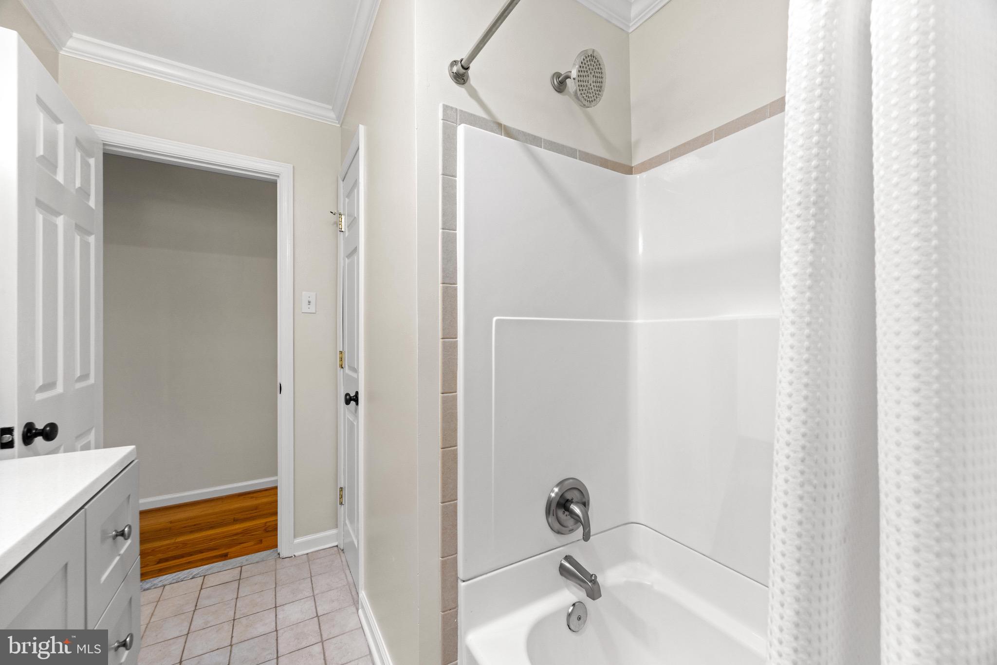 586 Forest View Road Linthicum Heights, MD 21090 - Photo 12 of 28 a bathroom with a tub and shower