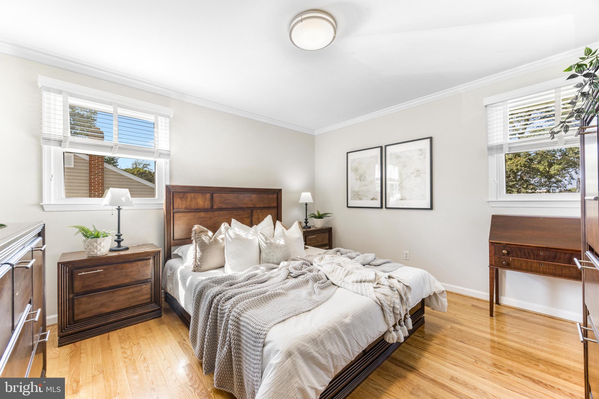 586 Forest View Road Linthicum Heights, MD 21090 - Photo 13 of 28 a bedroom with a bed and wooden floor