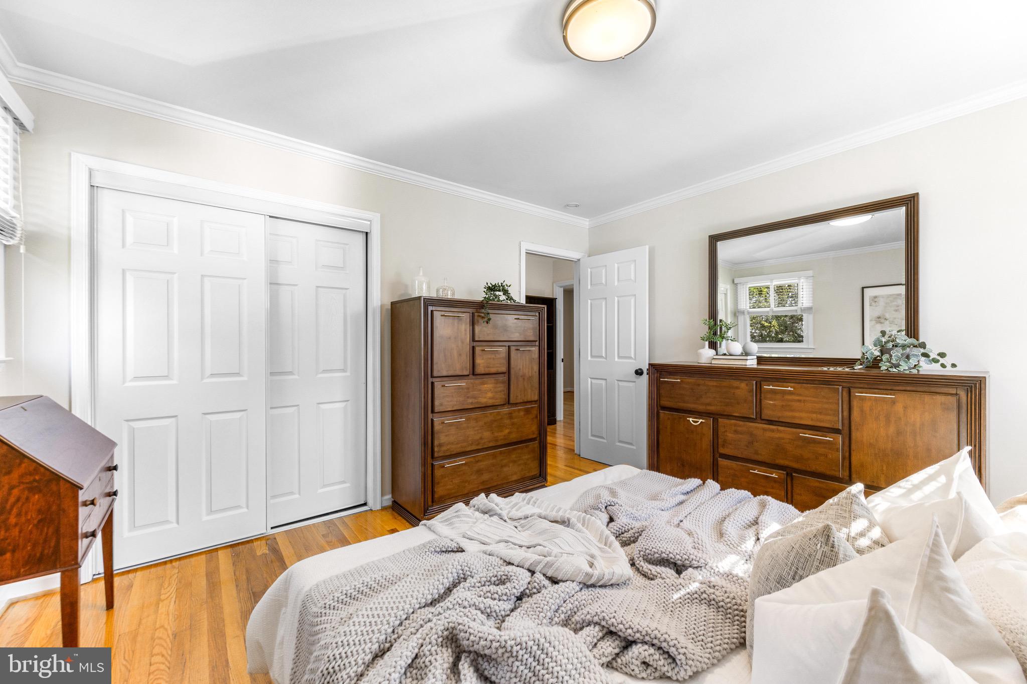 586 Forest View Road Linthicum Heights, MD 21090 - Photo 14 of 28 a bedroom with a bed and wooden floor