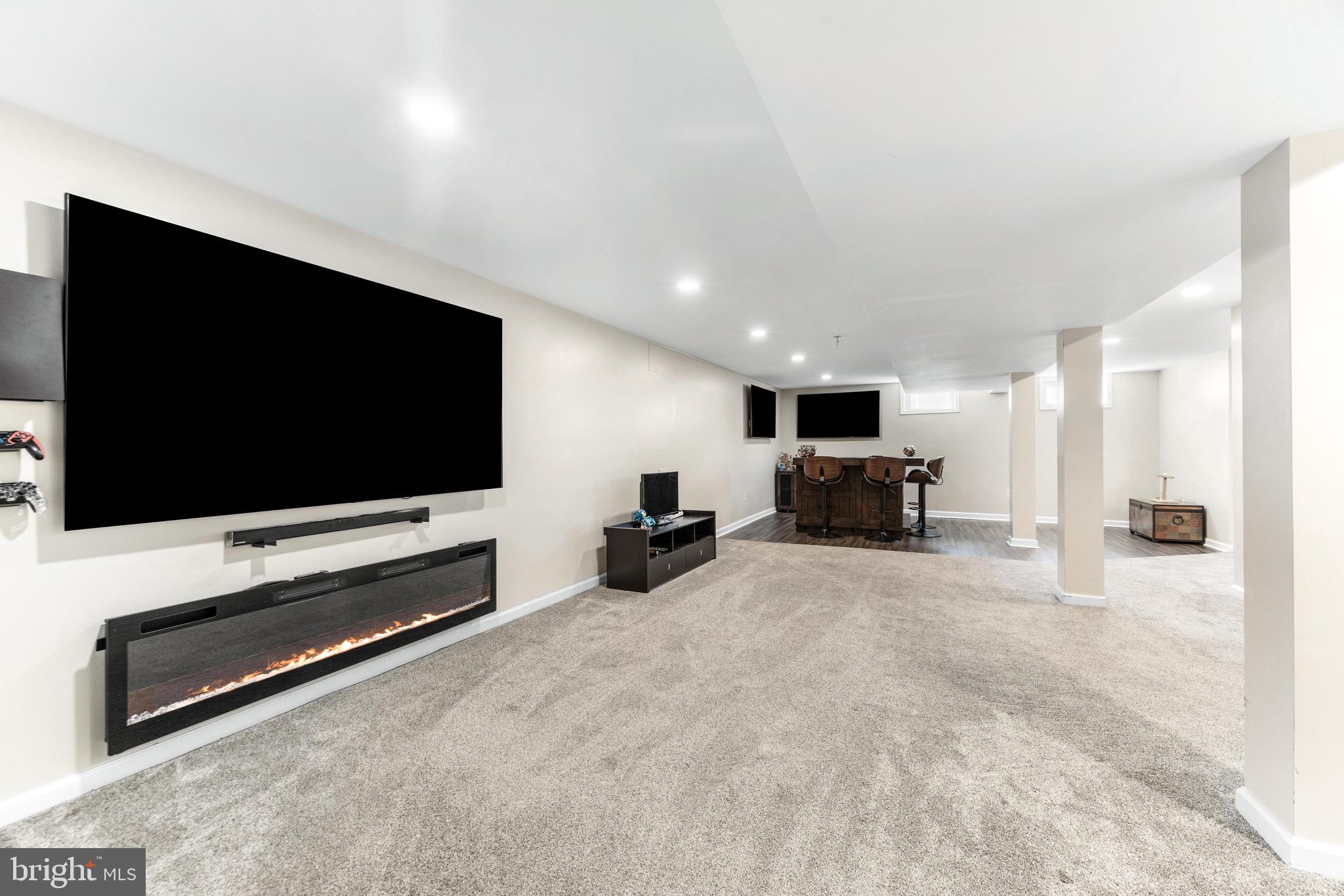 586 Forest View Road Linthicum Heights, MD 21090 - Photo 19 of 28 a living room with furniture and a flat screen tv
